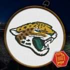 Jacksonville Jaguars Logo Counted Cross Stitch Pattern - Download in PDF 2 Jacksonville Jaguars logo counted cross stitch pattern displayed in a hoop over a stadium background